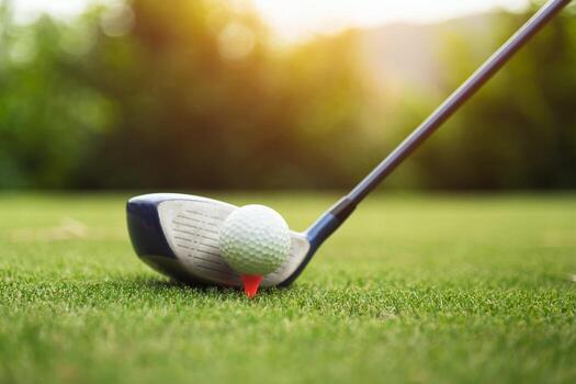 Golf ball on green grass ready to be struck